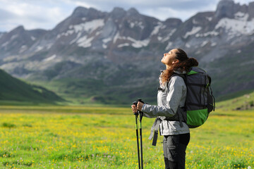 Hiker breathing fresh air in a high mountain