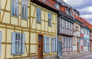 Fototapeta na wymiar Street with colorful half timbered houses in Quedlinburg, Germany