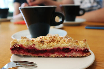 Cup of coffee and cake on the table