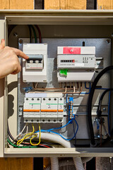 Turning circuit breaker in consumer unit with electrical meter.