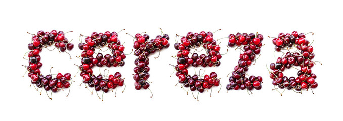 Sweet cherry - a sweet inscription from the berries of ripe cherries in Spanich cereza. Isolate on a white background, ready-made inscription for design and layout. Great gift and tasty treat