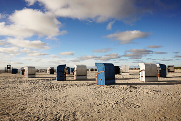 Beach chairs on the North Sea beach. Harlesiel in East Frisia, Wittmund district, Lower Saxony, Germany.