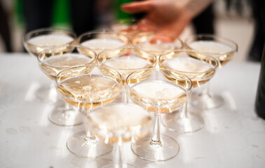 group of glasses with pink champagne on a high-class reception 
