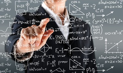 Mathematical expressions with business hand pointing a finger at a formula. Solution to the problem...