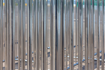 fence made of polished stainless steel pipes