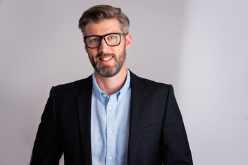 Confident businessman portrait while standing at isolated background