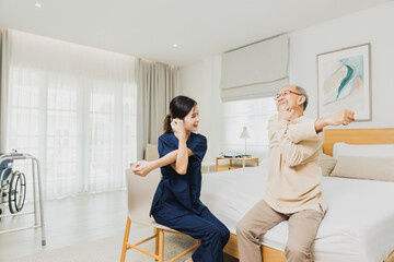 nurse woman assisting old man warming up exercises for the upper body inside the nursing home, use...