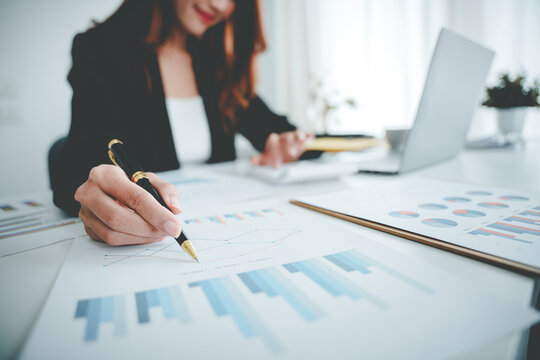 Asian woman working on customer documents, finance, accounting, taxes in the office.