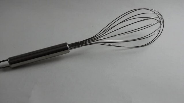 Whisk for whipping. Close-up on a white background.
