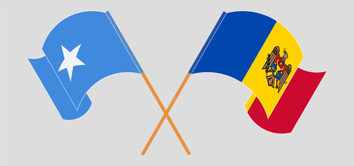 Crossed and waving flags of Somalia and Moldova