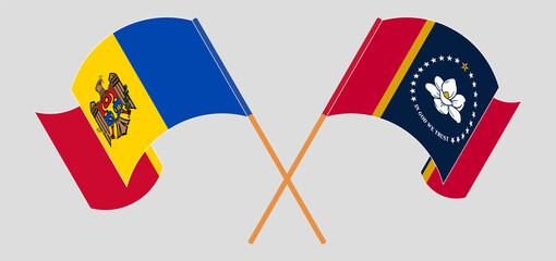 Crossed and waving flags of Moldova and The State of Mississippi