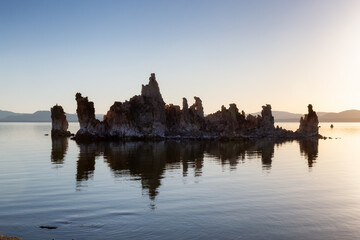 Fototapeta na wymiar Tufa towers rock formation in Mono Lake. Sunny Sunrise. Located in Lee Vining, California, United States of America. Nature Background.
