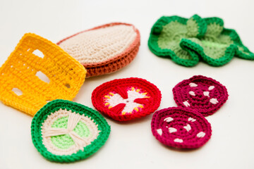 Handmade crochet sandwich with sausage, salad, cheese, cucumber and tomato. Healthy breakfast, kitchen toys for preschool children. Sensory cooking games at home, to develop kids imagination.