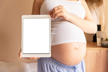 Pregnancy digital tablet mockup. Pregnant woman holding smart tablet. Mobile pregnancy online maternity application mock up. Concept of pregnancy, maternity, expectation for baby birth.