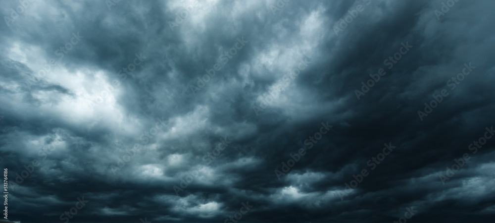 Poster The dark sky had clouds gathered to the left and a strong storm before it rained.Bad weather sky..