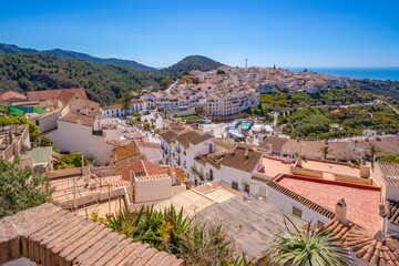 Panoramic view of whitewashed houses, rooftops and Mediterranean Sea, Frigiliana, Malaga Province, Andalucia