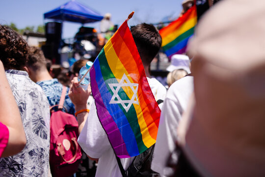 Gay parade in Israel, Tel Aviv june 2022.  Lgbtq pride month.  Rainbow flag and Star of David.  Freedom love tolerance.  Merry feast.  Liberalism.  Symbol against discrimination. gay parade