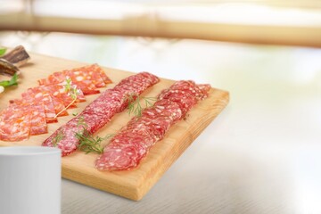 Traditional ham spiral sliced on desk with oranges and rosemary