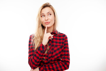 Smart blonde girl in casual holding chin thinks doubts, makes decision isolated on white studio background