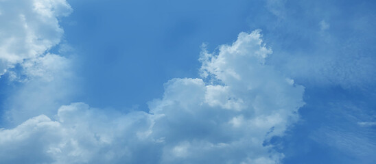 Beautiful bright and fresh blue sky background with clouds cape, Abstract watercolor painted cloudy blue sky background for wallpaper and creative design.