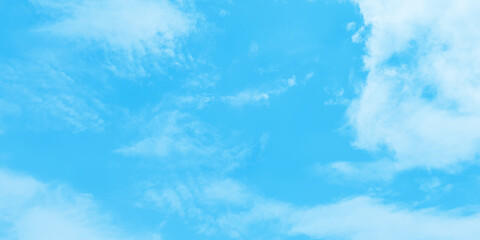 Abstract blue sky background of summer season with small clouds, fluffy and blurry summer sky background for wallpaper and design related works.