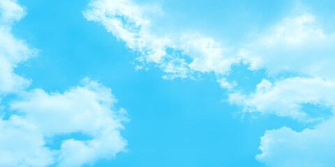 Naklejka na ściany i meble Abstract blue sky background of summer season with small clouds, fluffy and blurry summer sky background for wallpaper and design related works.