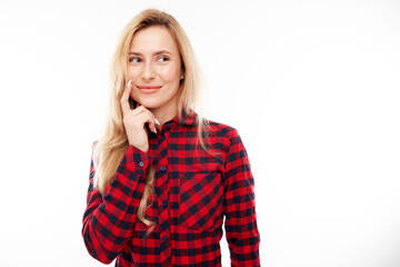 Smart blonde girl in casual holding chin thinks doubts, makes decision isolated on white studio background