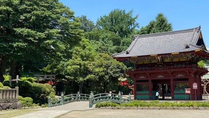 Fototapeta premium The “Shinkyo” bridge that leads to the two story gate of “Nezu” shrine, the honorable historic landmark on its purification ceremonial month, year 2022 June 28th