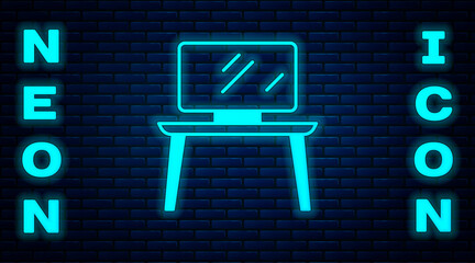 Glowing neon TV table stand icon isolated on brick wall background. Vector