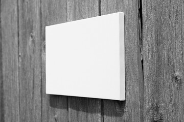 White stretched canvas mockup on wooden wall