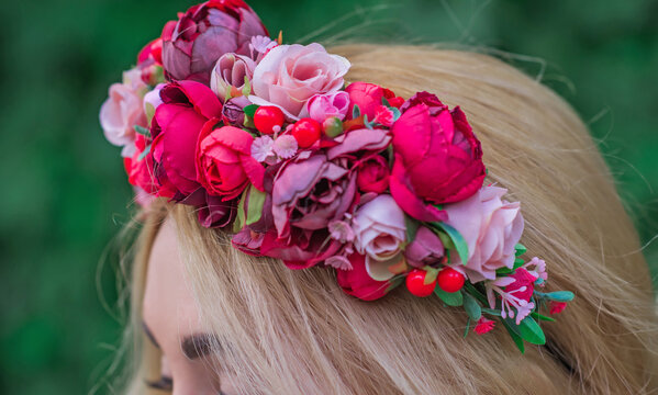 Woman With Flower Wreath On Her Head. Beautiful girl in romantic wreath  