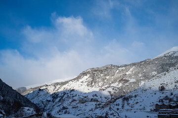 Fototapeta na wymiar snowy mountains of the Principality of Andorra. Snow, skiing, mountains, clouds, a perfect place.