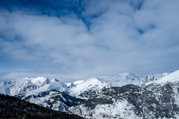 Fototapeta na wymiar snowy mountains of the Principality of Andorra. Snow, skiing, mountains, clouds, a perfect place.