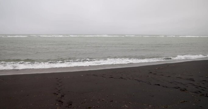 Black sand beach in Iceland with gimbal video moving forward.