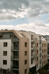 Obraz premium Modern apartment building with green zones below. Concept of an ecofriendly real estate investment in Europe