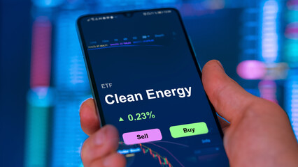 Clean energy ETF, an investor buys or sell an ecologic etf fund. Etf green subtainable transition climate change.