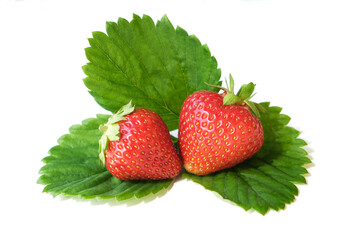 red strawberries on green leaves