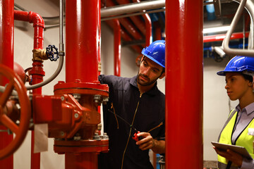 System engineer and technician work checking Fire suppression system and fire equipment - obrazy, fototapety, plakaty