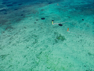 Windsurfing in tropical ocean at Mauritius. Aerial view.