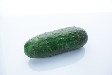 Green cucumber on white background
