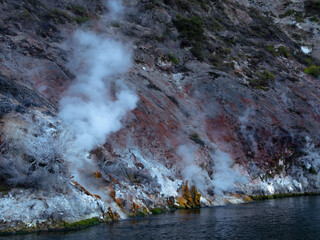 White Steam Rising From the Rocks, From the Underground Geyser on the Lakeside. Rotomahana Lake,...