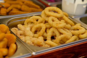 onion rings in a metal container.