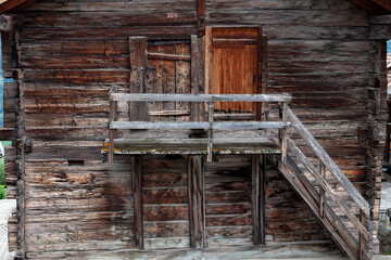 old wooden door and a small balcony 