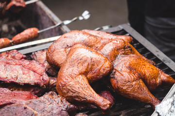 smoker with meat at street food festival