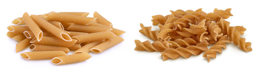 Wholegrain penne and fusilli pasta from durum wheat isolated on white background with clipping path...
