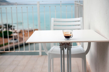 having espresso on a balcony