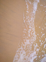 Fototapeta na wymiar Beautiful wave on the beach, clear water, white sand in your holliday at Goa India.