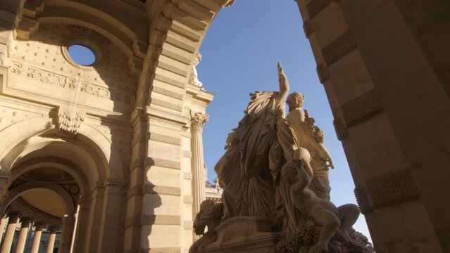 Travelling from behind the statue of the Longchamp Palace in Marseille, France