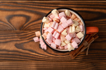 Cocoa drink on texture background. Hot chocolate with small marshmallows and spices. Winter warming drink concept. Space for copy. Space for text