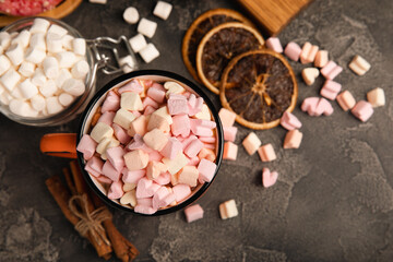 Cocoa drink on texture background. Hot chocolate with small marshmallows and spices. Winter warming drink concept. Space for copy. Space for text
